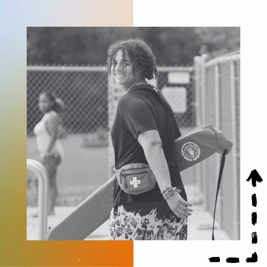 Photos of a lifeguard at camp wearing the swimming shirt and smiling