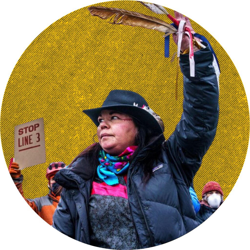 Sarah LittleRedfeather of Honor the Earth dances with an eagle feather in front of the construction site for the Line 3 oil pipeline near Palisade, Minnesota, on January 9, 2021. Kerem Yucel/AFP via Getty Images